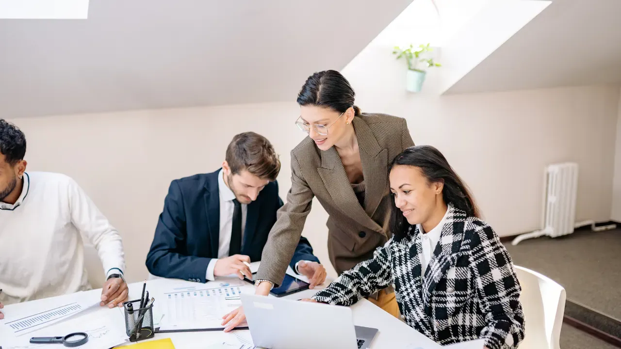 A professional sharing ideas with her team